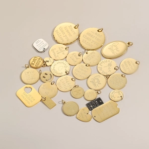 Custom engraved 316L stainless steel coin pendants in gold, silver, and black finish