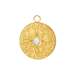 Macro detail of gold tarot sunburst pendant with sparkling zircon and beaded texture