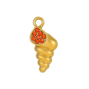 Macro detail of golden seashell pendant with orange zircon stones in teardrop pattern