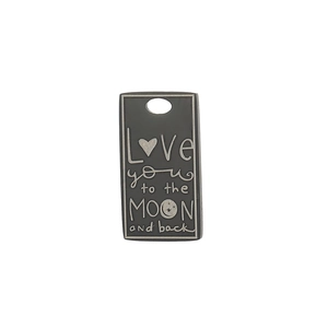 Macro detail of rectangle stainless steel pendant with engraved romantic quote