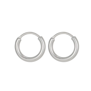Close-up of polished silver geometric hoop earrings made of high-quality stainless steel