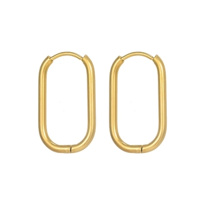 Macro detail of gold oval hoop earrings showing high-polish finish and snap closure