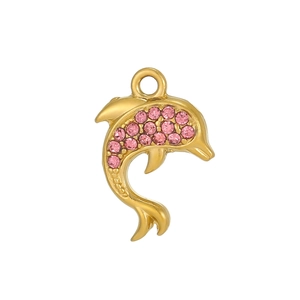 Detailed view of a golden dolphin pendant with pink cubic zirconia stones on white background