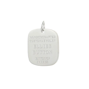 Detail of silver square dog tag pendant with handcrafted engraved lettering
