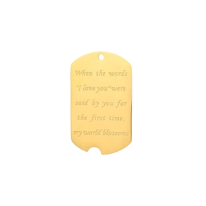 Detail of gold dog tag pendant with romantic engraving and unique notched edge design