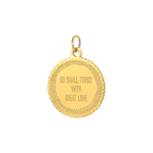 Detailed macro view of gold-plated stainless steel round pendant with engraved message