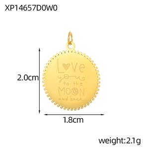 Macro detail of a round gold pendant engraved with Love you to the MOON and back text