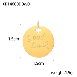 Macro detail of 1.5cm round Good Luck clover pendant in gold stainless steel