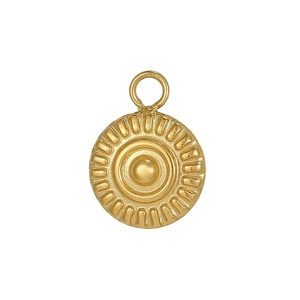 Macro shot of gold circular pendant with sunburst texture and central raised dome