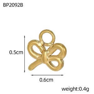 Detail of a 0.5x0.6cm mini golden butterfly pendant for DIY jewelry making