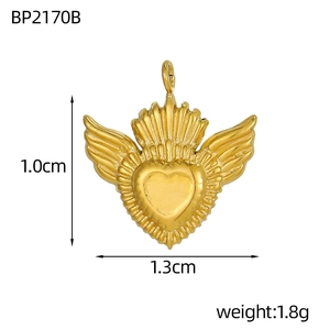 Golden winged heart pendant detail showing 1.0cm height and 1.3cm width dimensions