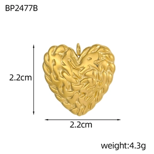 Detailed view of golden heart pendant with lava texture measuring 2.2cm and weighing 4.3g