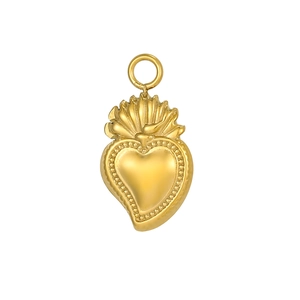 Detailed view of a golden sacred heart pendant with flame crown and beaded edges for DIY