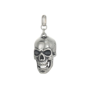 Macro detail of gothic skull pendant showing oxidized silver finish and hollow eye sockets