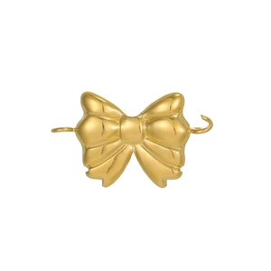 Detailed macro view of a gold-plated bow-shaped stainless steel connector for DIY jewelry