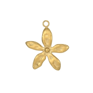 Macro detail of golden stainless steel flower pendant with brushed metal texture and ring