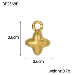 Detailed view of a gold-plated clover pendant showing dimensions 0.8cm by 0.6cm