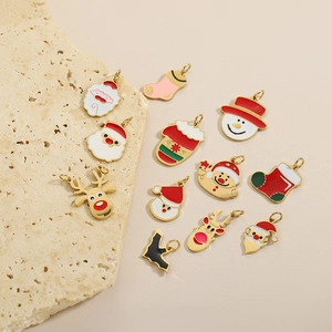 Set of 11 handmade Christmas enamel charms with reindeer and Santa in gold metal finish
