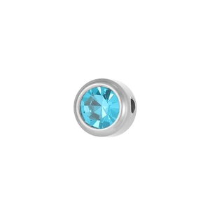 Macro view of a 6mm light blue birthstone charm with silver stainless steel base