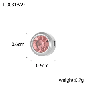 Detailed view of a 6mm silver-tone round bead with pink crystal and sizing markers