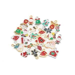 DIY Christmas charms collection featuring Santa, reindeer, and enamel holiday pendants
