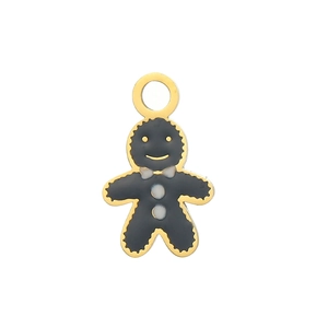 Vue macro d'un pendentif bonhomme de pain d'épices en émail noir et doré