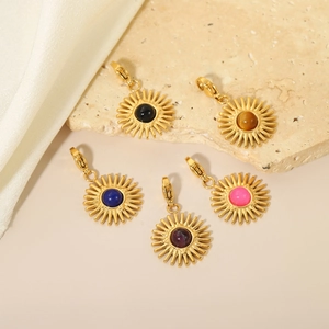 Set of five gold sunburst pendants with multi-colored gemstones and lobster clasps