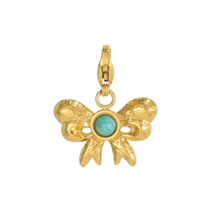 Detail of vintage gold bow pendant featuring hammered texture and a green stone inlay
