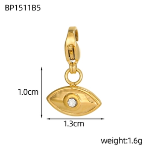 Detailed macro view of gold Evil Eye heart pendant showing dimensions and weight