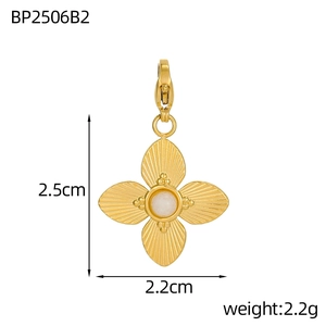 Detailed size view of a 2.5cm gold flower pendant with center white gemstone inlay