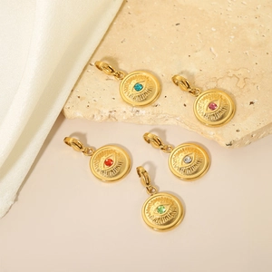 Close-up of five colorful Evil Eye heart charms with lobster clasps in gold finish