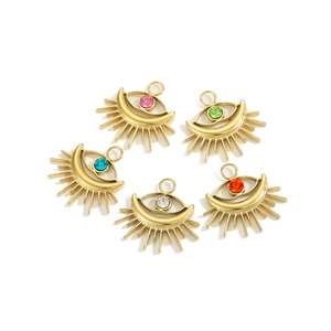 Detailed view of colorful evil eye pendants in gold finish with vibrant rhinestones