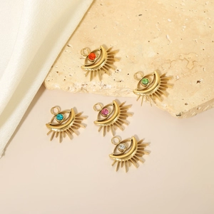 Detail of five evil eye heart charms with colorful rhinestones for DIY jewelry making