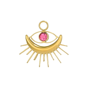 Detail of tarot heart pendant with pink gemstone and evil eye gold plating motif