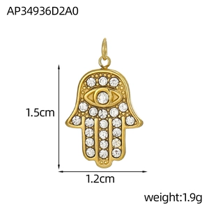 Detail view of gold Hamsa hand pendant with colorful zirconia and size dimensions