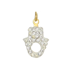 Detailed macro of a silver Hamsa Hand pendant with sparkling zircon micro-inlay accents