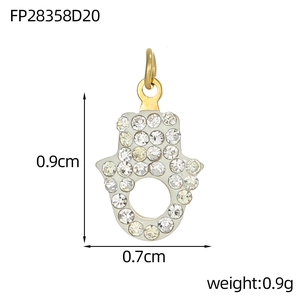 Detailed view of Hamsa hand pendant with micro-paved zircons measuring 0.9cm x 0.7cm