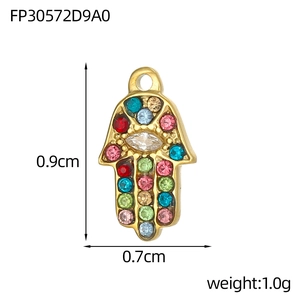 Detailed view of gold Hamsa pendant with multi-color zircons and size specifications
