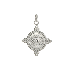Macro shot of silver Evil Eye pendant with clear zircon inlay and wave patterns