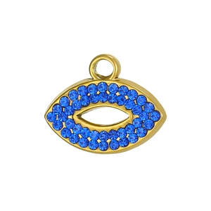 Macro shot of evil eye pendant with blue zircon stones and gold plating for DIY jewelry