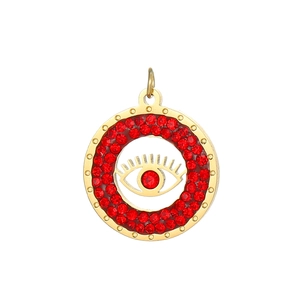 Macro detail of golden Evil Eye pendant with red zircon crystals and intricate inlay