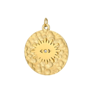 Macro detail of gold-plated evil eye pendant featuring hammered texture and zircon stone