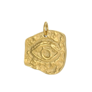 Detail of golden irregular evil eye pendant with hammered texture for jewelry making