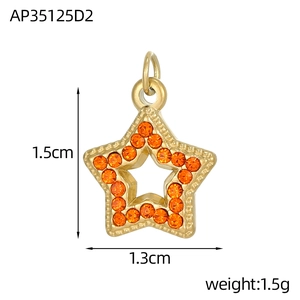 Detailed close-up of a golden star pendant featuring vibrant orange pavé zircon stones
