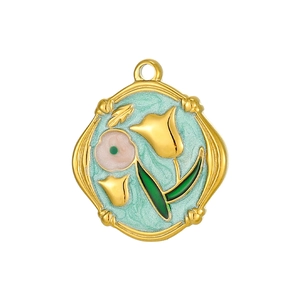 Close-up of gold tulip pendant with blue enamel and irregular wavy edges detail