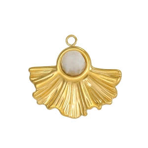 Detailed view of a golden stainless steel pendant with white gemstone and ginkgo leaf design