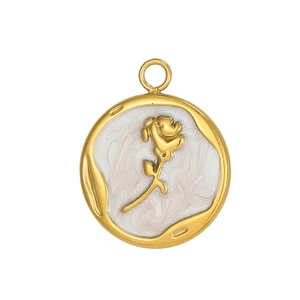 Detailed macro view of a round gold pendant featuring a 3D rose and pearlescent inlay