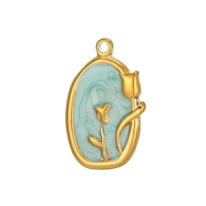 Detailed close-up of golden oval tulip pendant with mint green enamel and 3D floral relief