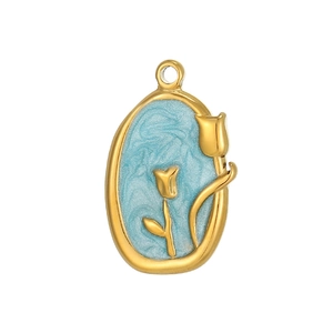 Macro view of gold oval tulip pendant with light blue enamel inlay and textured details