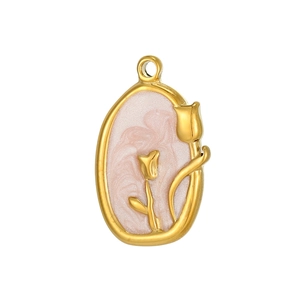 Macro shot of gold tulip charm with pink marble enamel and intricate floral details